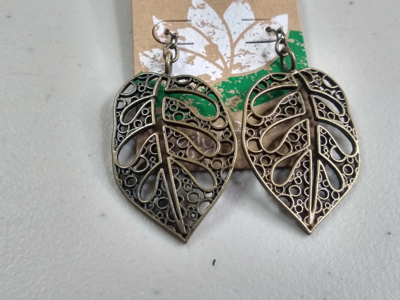 Silver-tone filigree leaf drop earrings with emerald-green enamel, hook backs