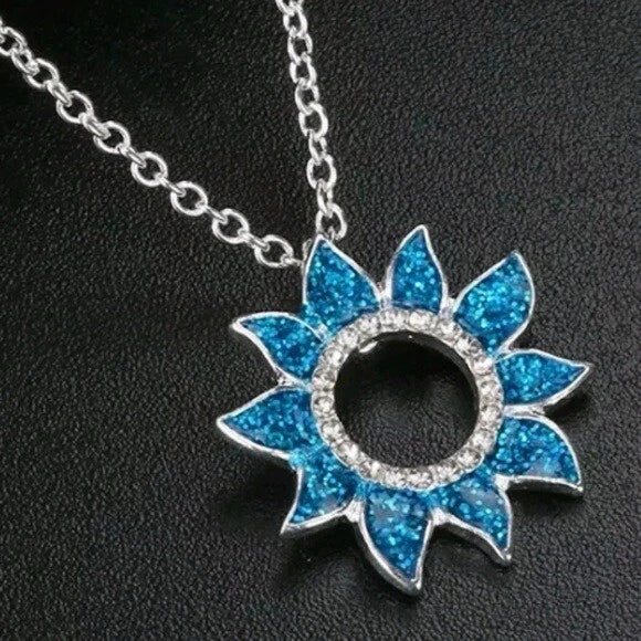 Blue opal sunflower necklace with silver chain and blue glitter petal pendant
