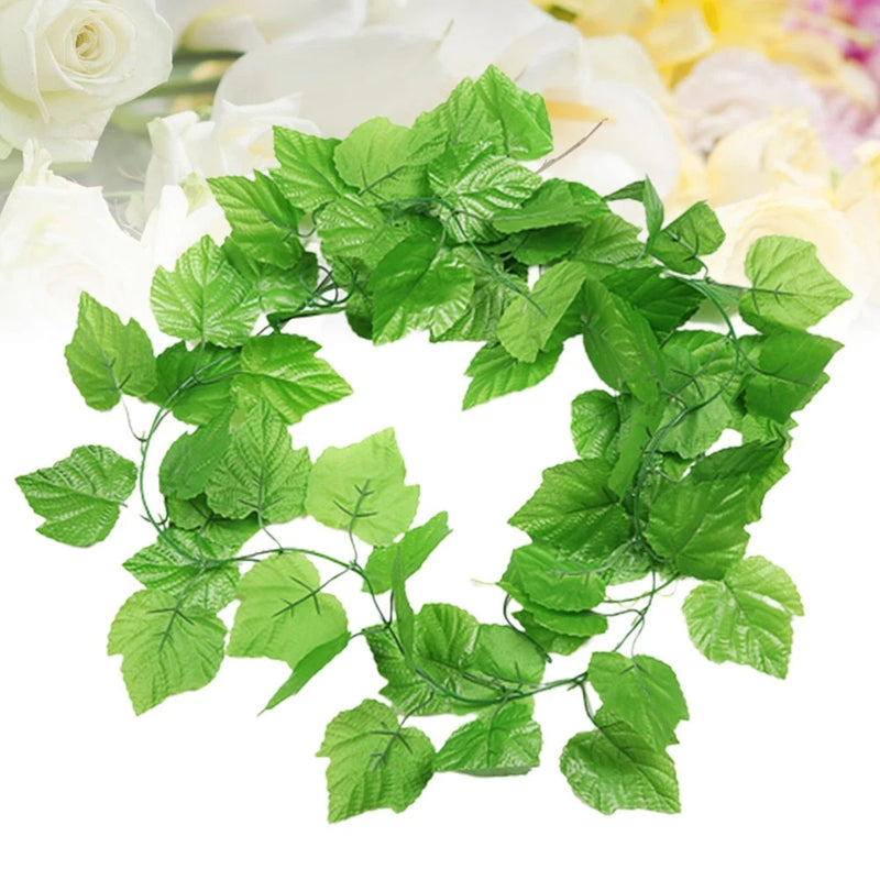 Green artificial grape leaf vine with layered leaf clusters and trailing stems