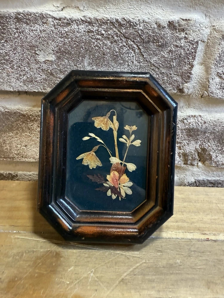 Octagonal wood-framed pressed dried flower wall art with botanical arrangement