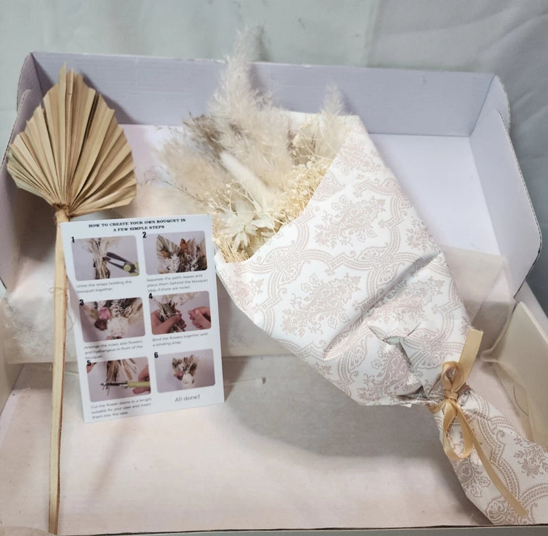 Natural dried flower bouquet in beige gift box with fan-like dried petals