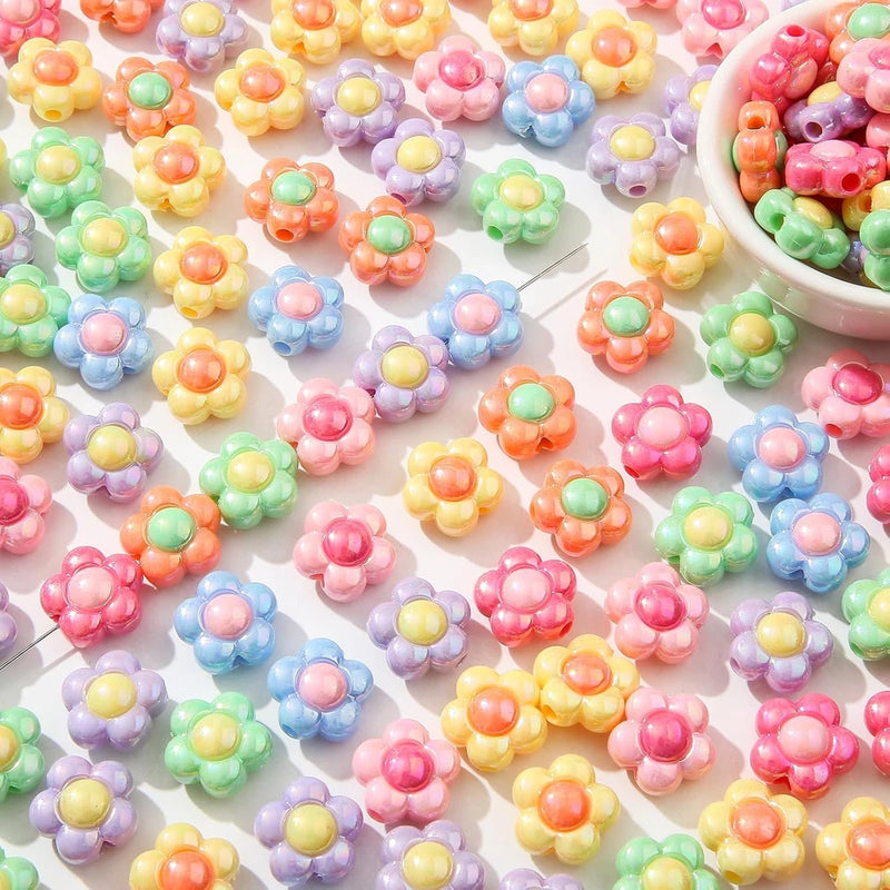 Colorful flower-shaped acrylic beads in pastel rainbow shades for jewelry making