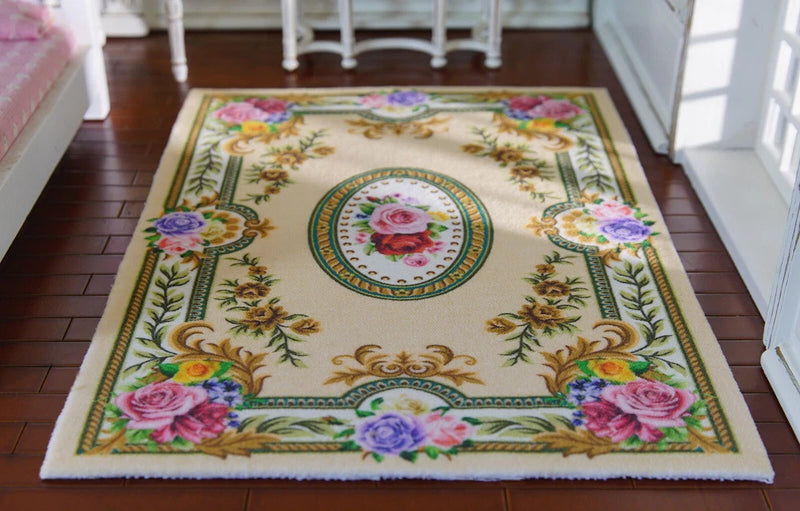 Miniature dollhouse rug with cream floral roses and ornate multicolor border