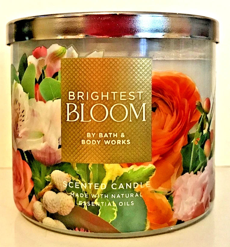 Large 3-wick scented candle in clear glass jar with gold lid and floral label