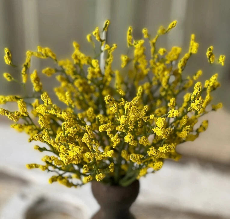 Yellow artificial astilbe floral pick with clustered blooms on green stems, decor sprig