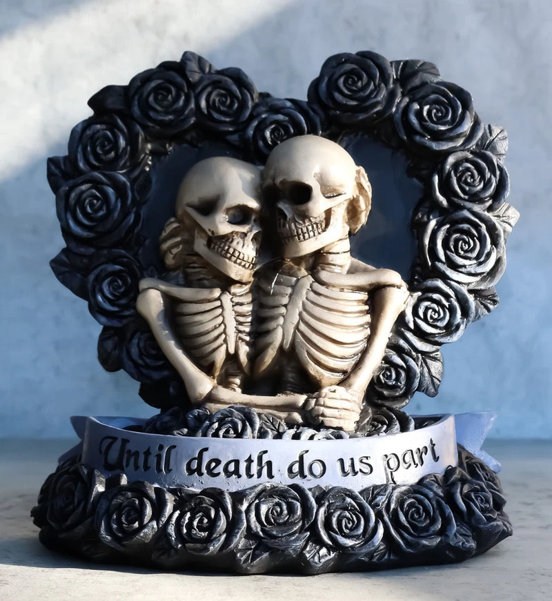 Black rose heart wreath figurine with two skeletal couple heads and ribcage detail