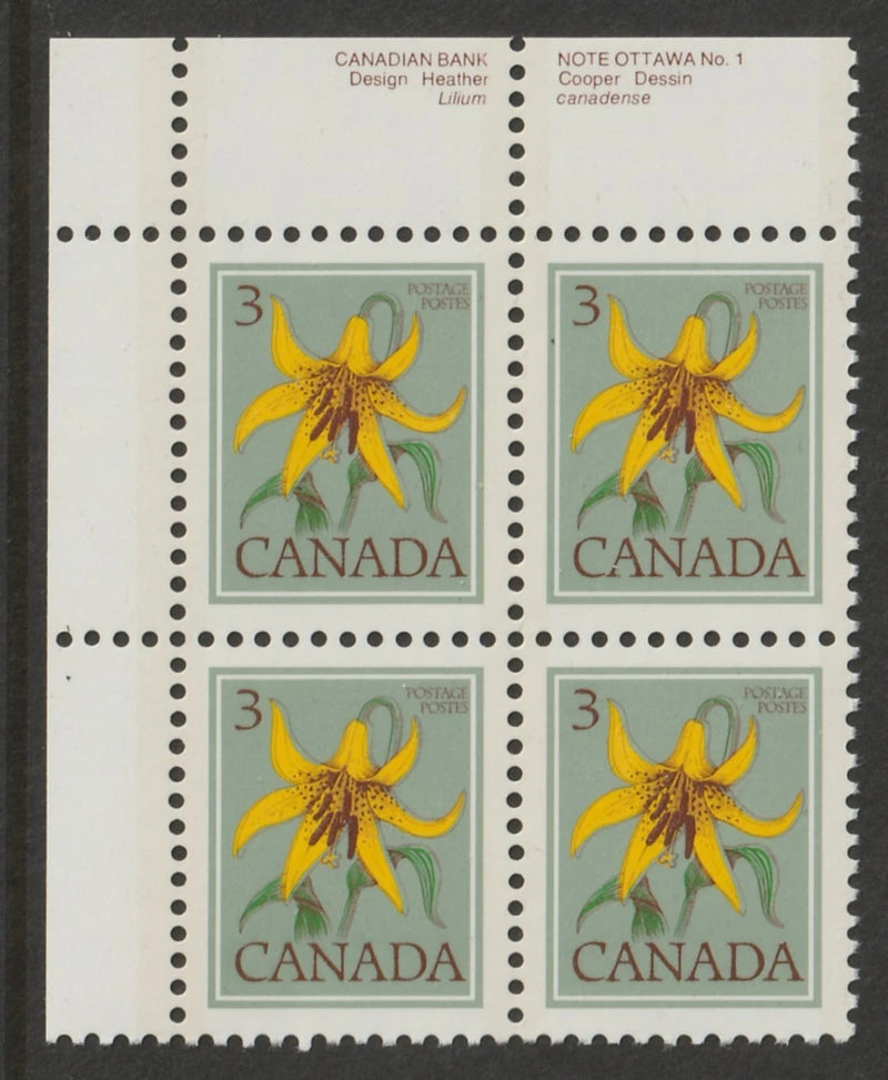 Set of four Canada postage stamps featuring yellow lily flowers with Canada text