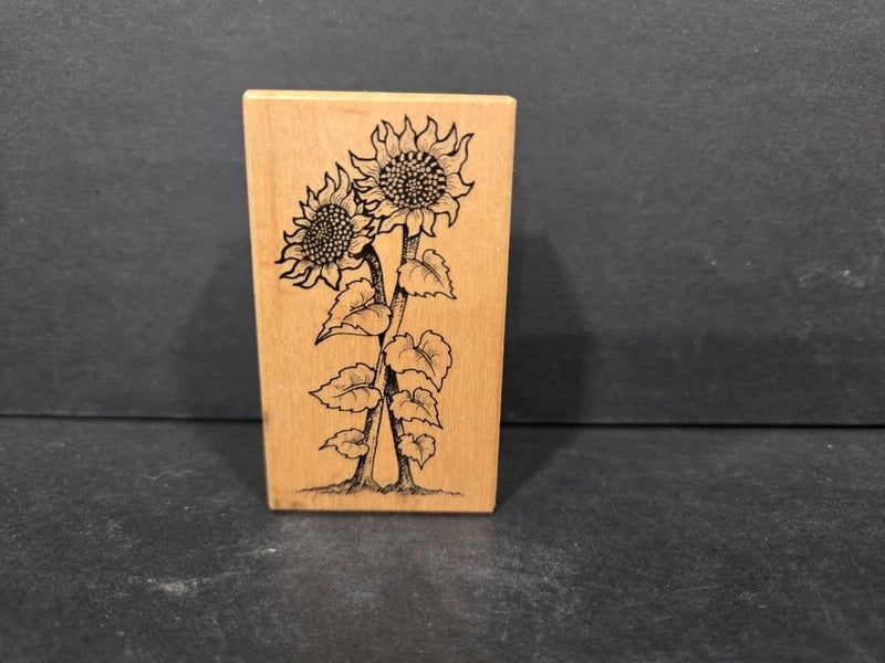 Sunflower rubber stamp with engraved floral stem and two blooms on rectangular wooden block