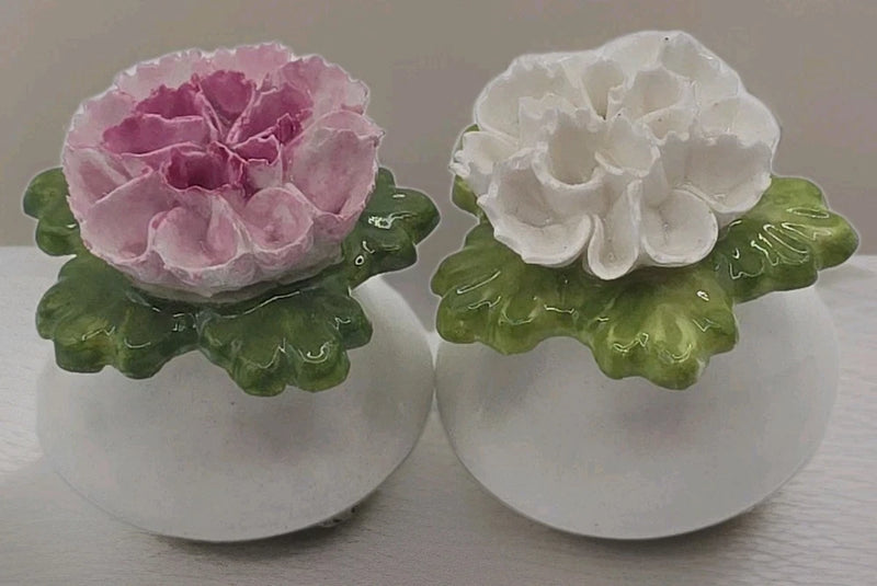 Fine bone china carnation salt and pepper shakers with pink and white floral tops, green bases