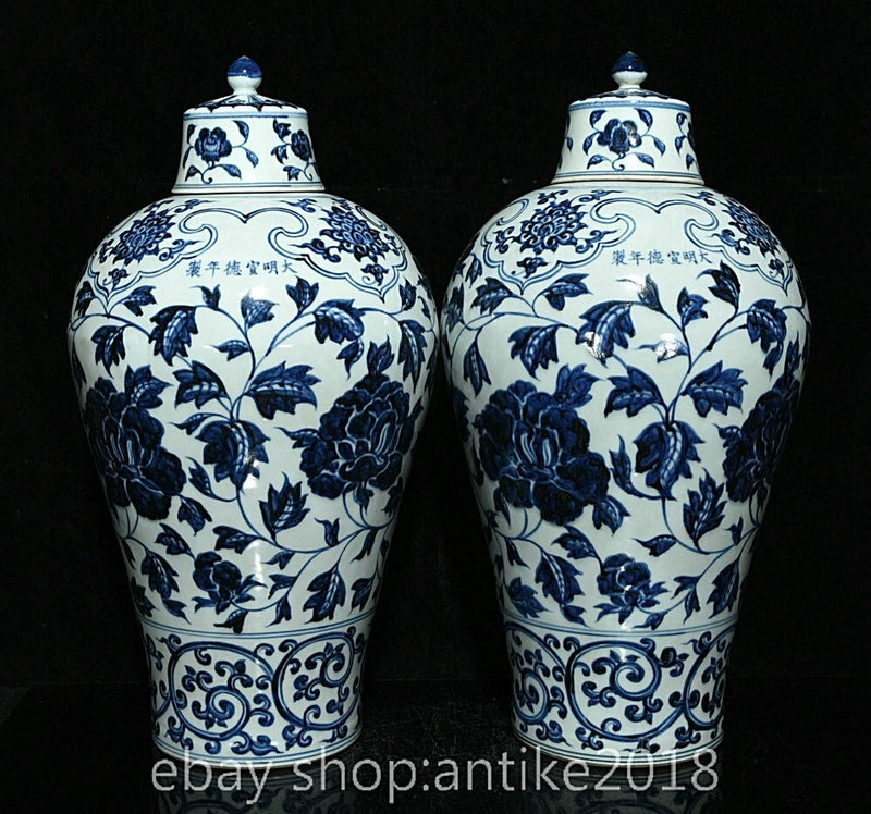 Blue and white porcelain lidded vases with floral and bird pattern, paired