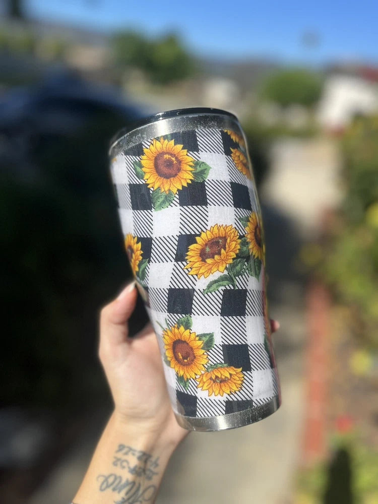 Sunflower tumbler with black-and-white buffalo check design and sunflower graphics, stainless lid