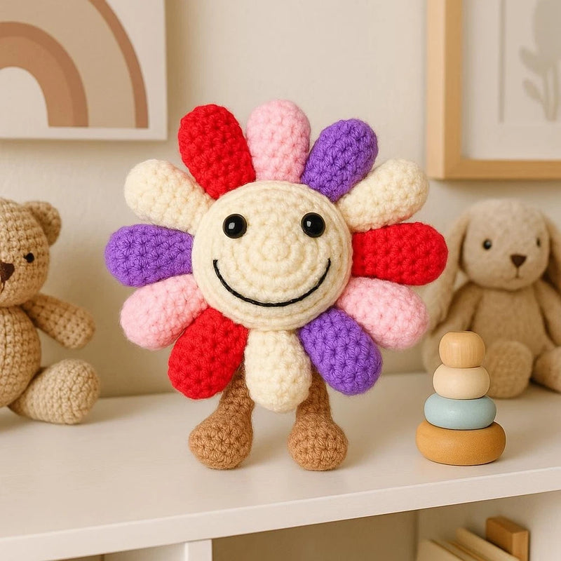 Crochet sunflower plush toy with smiley face, multicolor petals, soft stuffed body