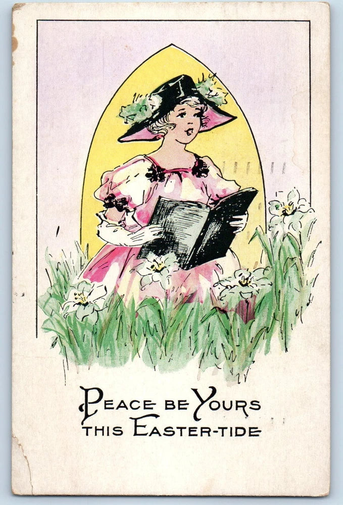 Vintage Easter postcard of woman holding book in lilies, with 'Peace be Yours' text.