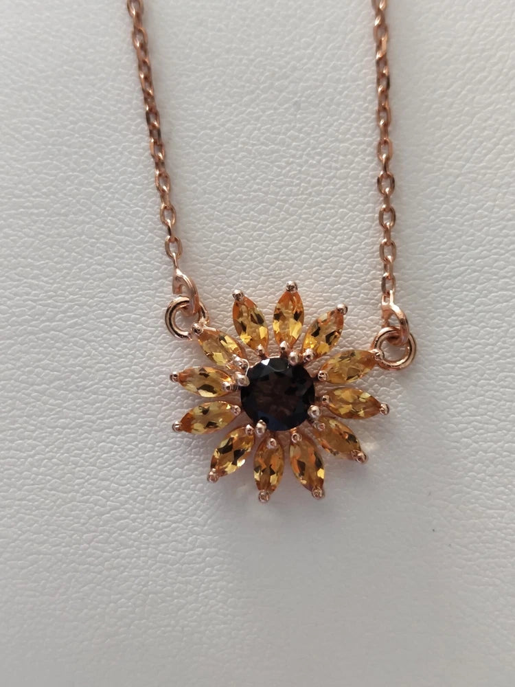 Sunflower pendant necklace with citrine-gold stones and dark center on fine chain