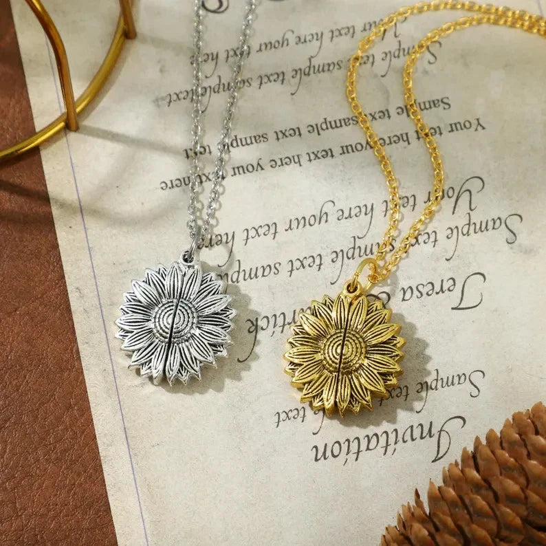 Sunflower pendant necklaces with textured centers, silver and gold finishes