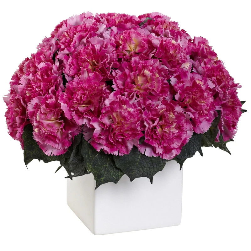 Dark pink faux carnation flower arrangement in a white ceramic square vase