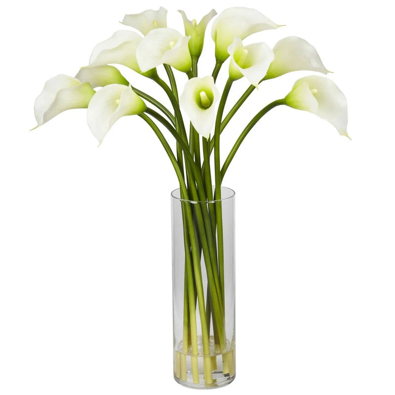 Cream calla lily silk flower arrangement with green stems in clear glass vase