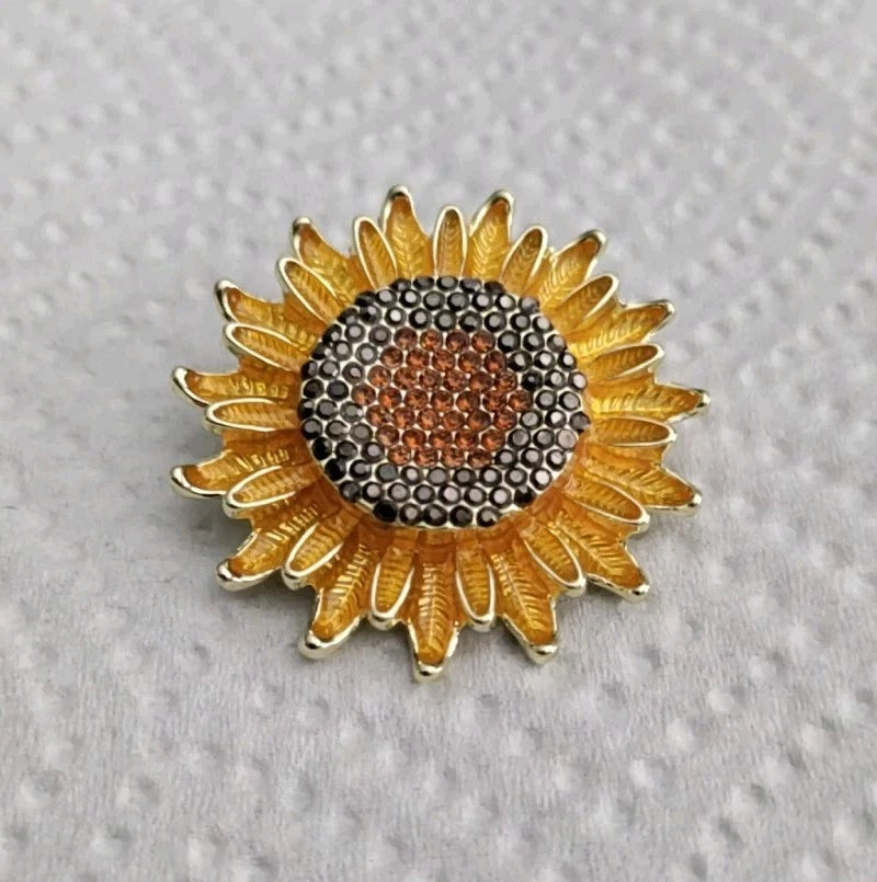 Gold-tone enamel rhinestone sunflower brooch with orange center