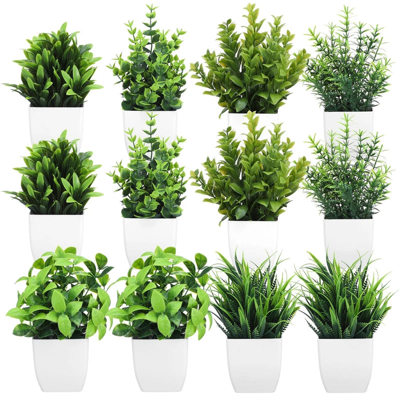 Set of mini artificial green potted plants in white square planters