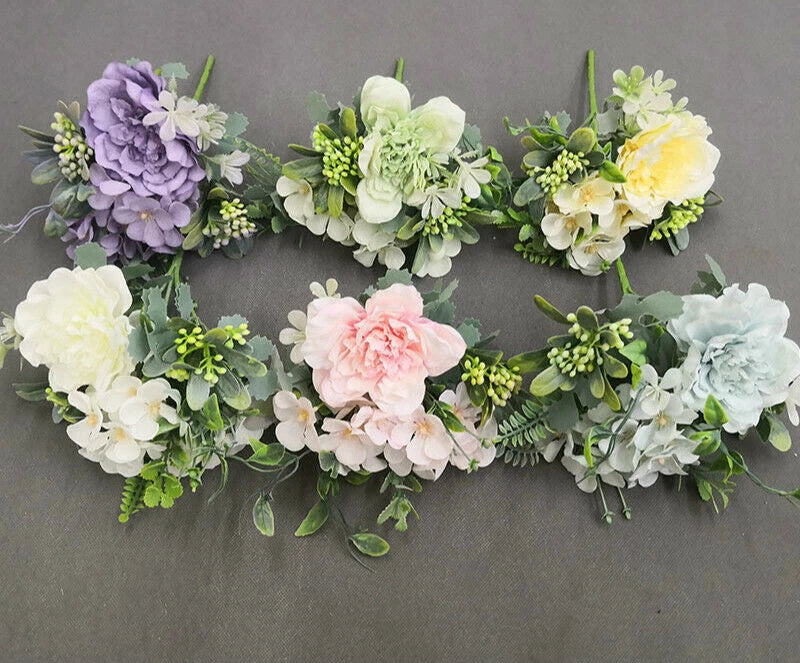 Artificial flower garland with peony and tea rose blooms in pastel lilac, pink, and cream