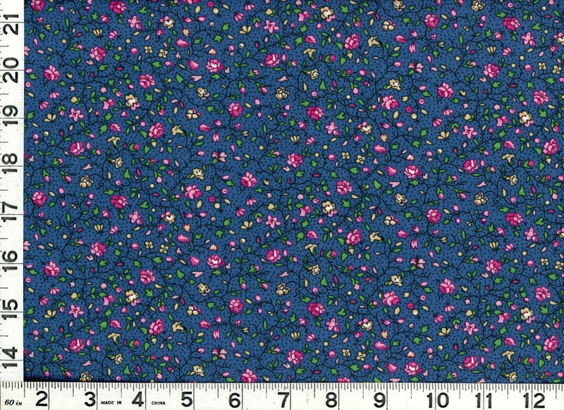 Dark blue quilting fabric with pink roses and leafy vines floral pattern.
