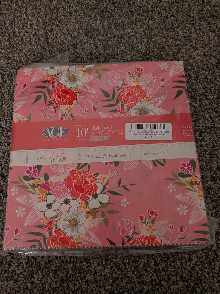 Pink floral fabric stacker with rose and bloom print, 10 in squares for sewing