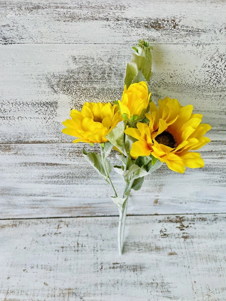 Single yellow sunflower floral spray with green leaves on a straight stem