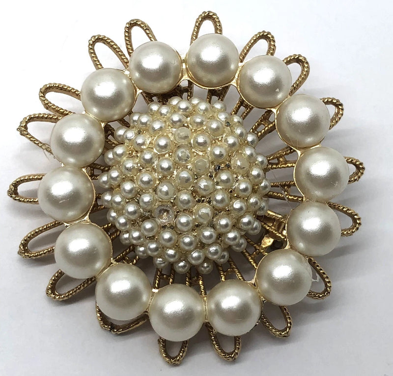 Vintage sunflower starburst pin brooch with faux pearl cabochon center and gold-tone petals
