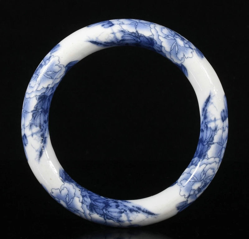 Blue and white porcelain bangle bracelet with swirling crackle pattern