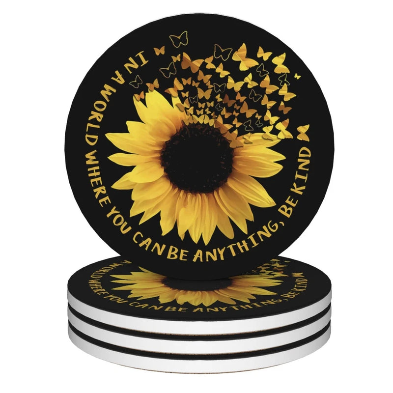 Round ceramic drink coasters with sunflower graphic and black-and-yellow design, set of 4