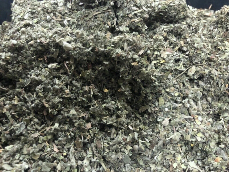 Dried shredded herb leaves, fluffy gray-green texture