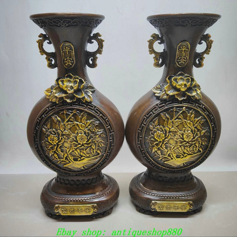 Pair of bronze gilt flat bottle vases with embossed peony flowers and ornate handles