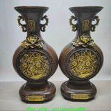 Pair of bronze gilt flat bottle vases with embossed peony flowers and ornate handles
