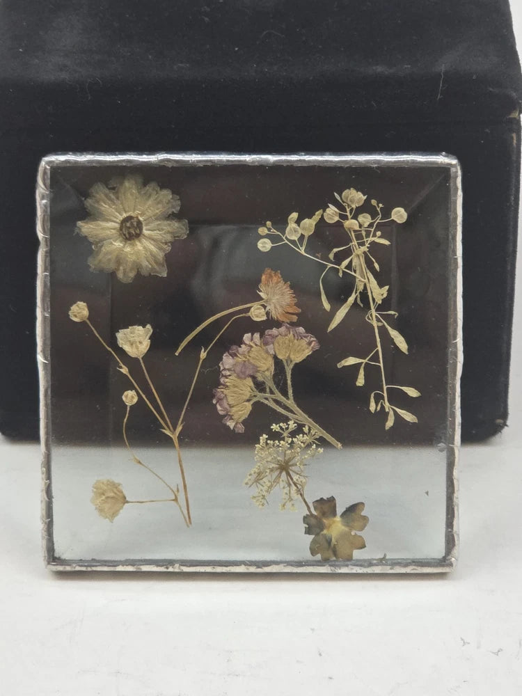 Beveled glass sun catcher with pressed dried flowers in a leaded frame