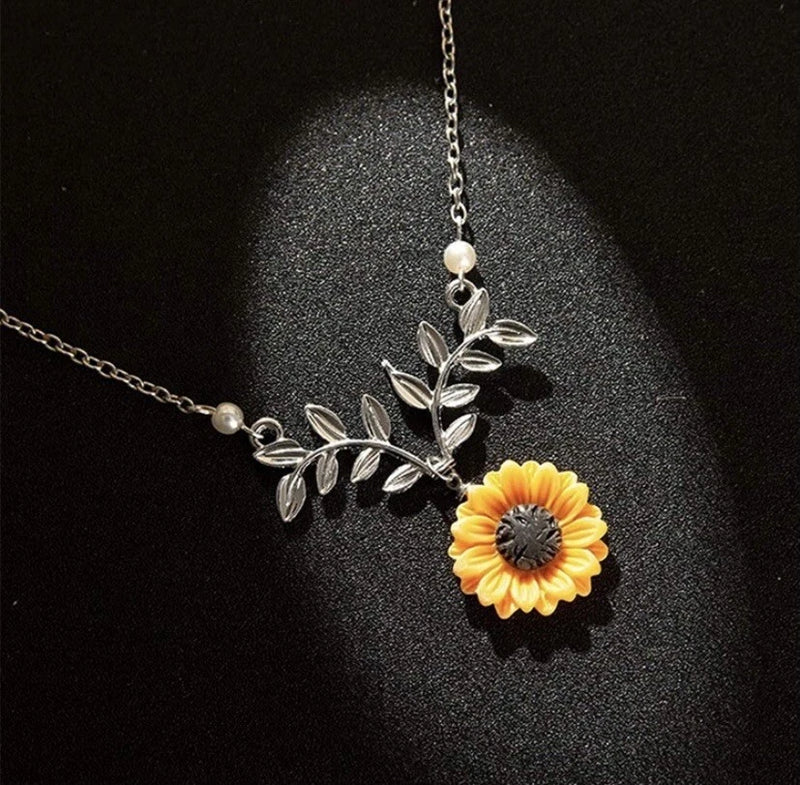 Sunflower pendant necklace with silver leaf charm and orange flower detail