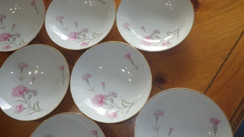 White fine china cereal bowls with pink carnation floral pattern, round coupe shape