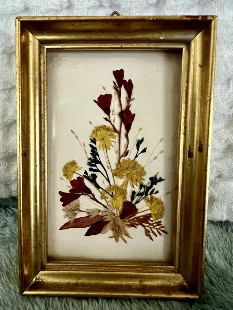 Vintage dried flower picture in gold frame with burgundy and yellow pressed blooms arrangement