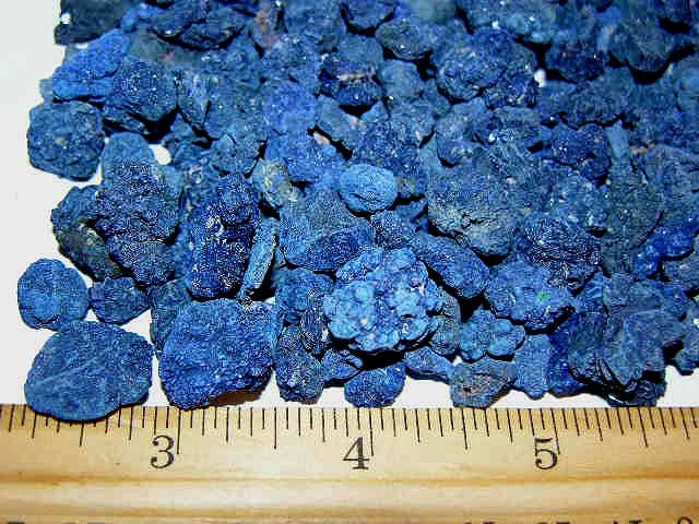 Blue azurite crystal cluster pieces with ruler size reference