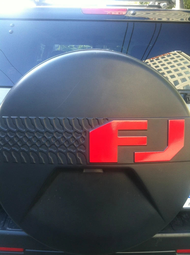 Spare tire cover decal with red FJ logo on dark cover