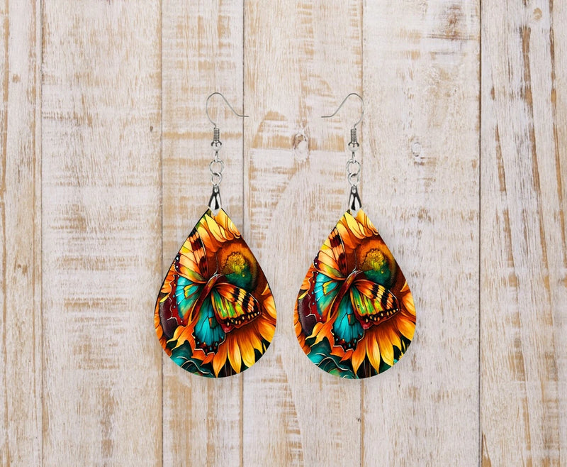 Teardrop dangle earrings with bold sunflower print and silver-tone hooks