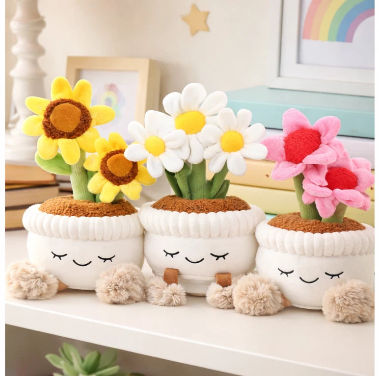 Plush faux houseplant decor with smiling faces, white pots, and daisy, sunflower, pink flowers