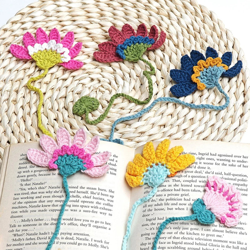 Crochet flower bookmark with colorful yarn appliques in pink, blue, and yellow
