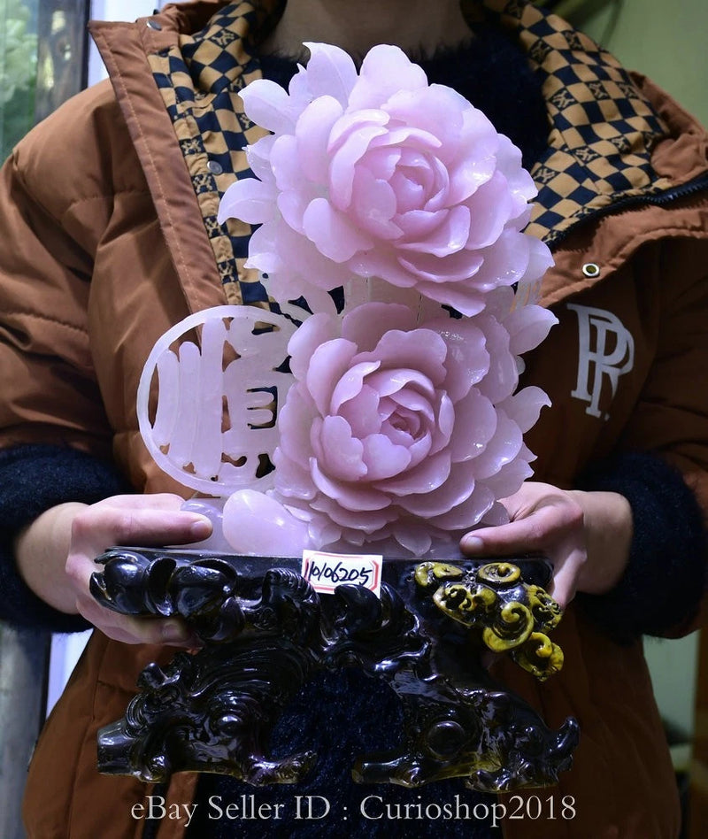 Pale pink and white peony jade-style carving sculpture with ornate dark base and sign