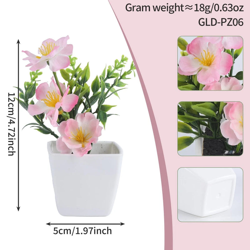 Mini artificial pink peach blossom potted plant with green leaves in white square pot