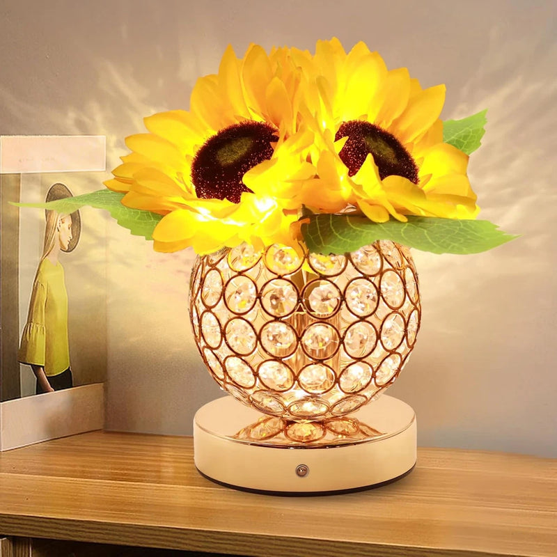 Sunflower touch lamp with glowing bulb pattern base and green leaves, warm light