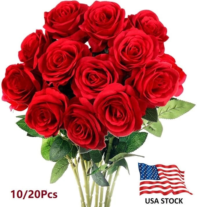Red artificial rose bouquet with stems and green leaves
