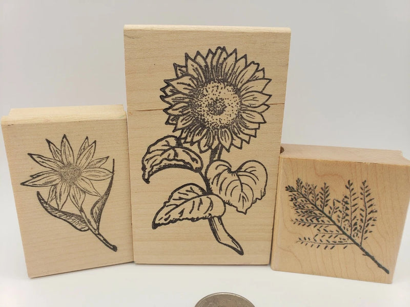 Set of 3 garden rubber stamps with sunflower and leaf designs on wooden blocks