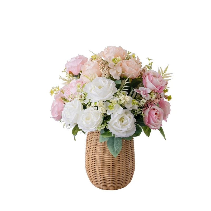 Artificial rose bouquet with pink and white flowers in woven basket vase