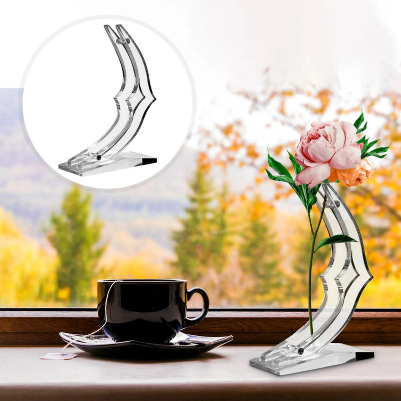 Acrylic rose decoration stand with clear base, holding pink rose bouquet and green leaves