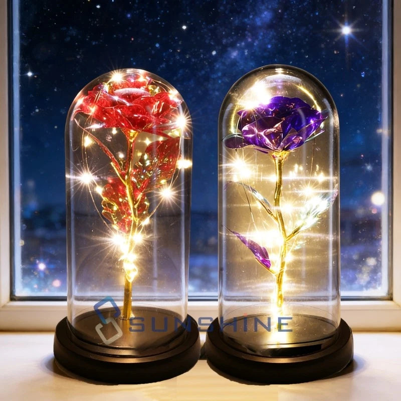 Glowing rose in clear glass dome with LED lights, gold and purple